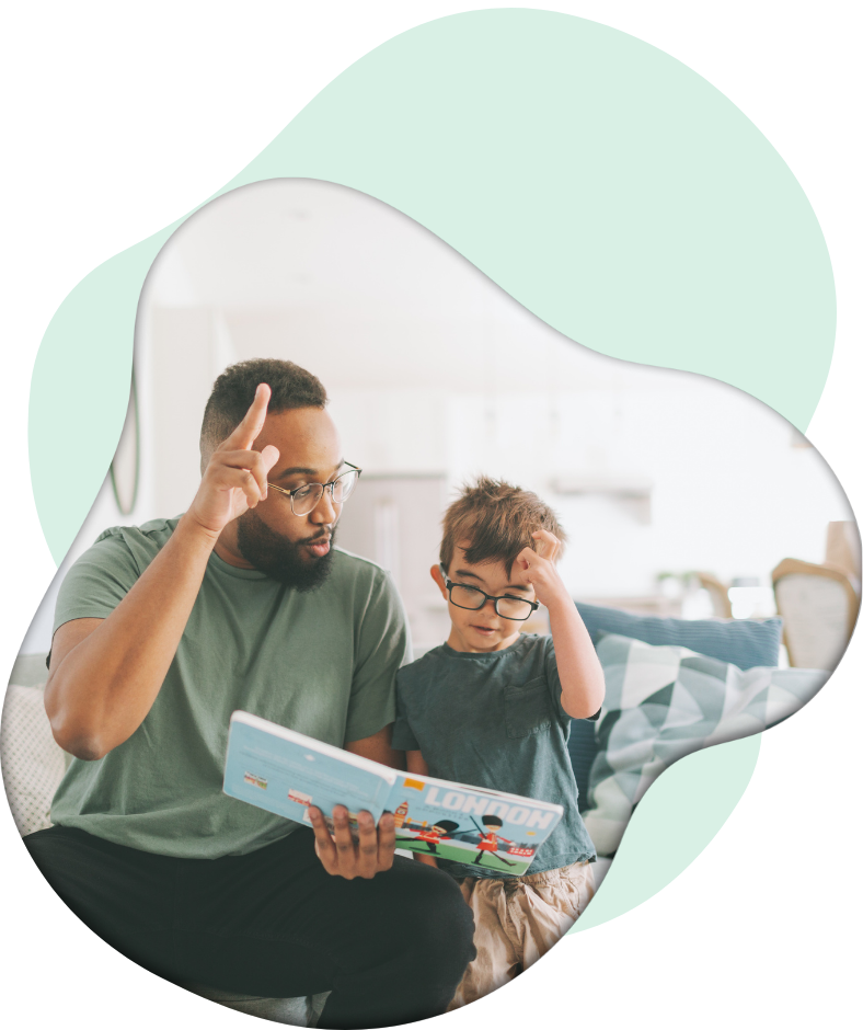 BSC-man teaching sign language to young boy